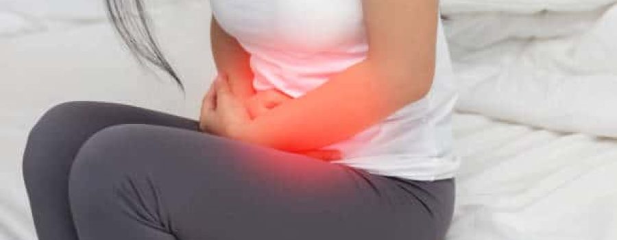 stomachache in young Asian woman